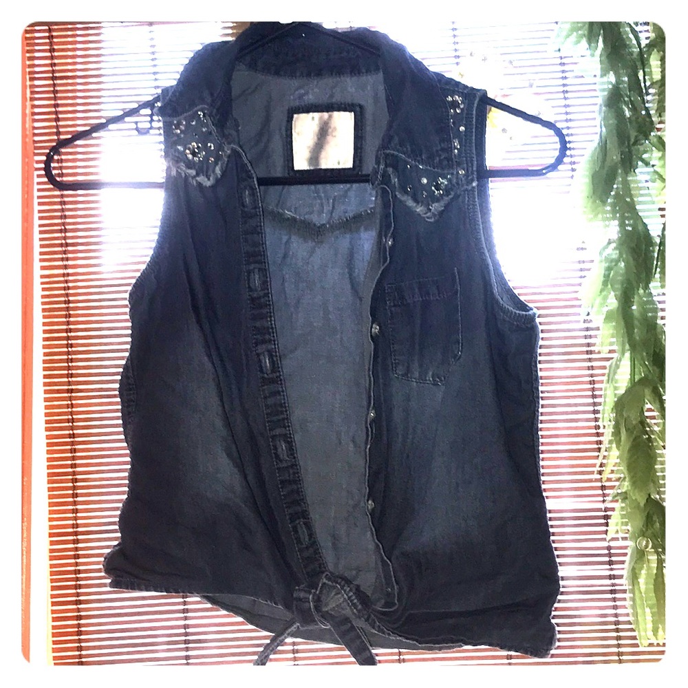 A button up thin jean vest and ties on bottom